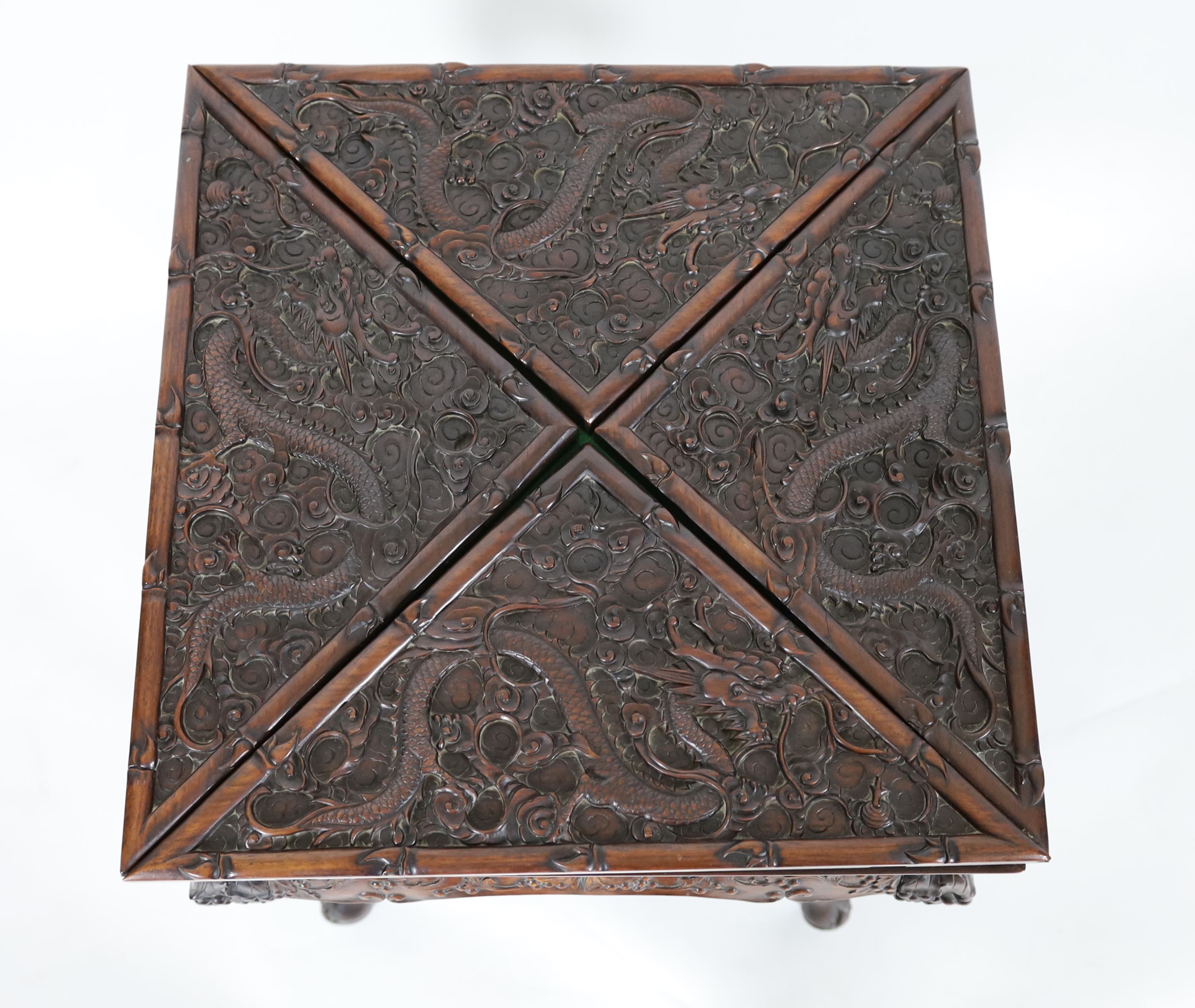 A Chinese hongmu ‘dragon’ envelope card table, c.1910, 55 cm Square, 78 cm high, some splits